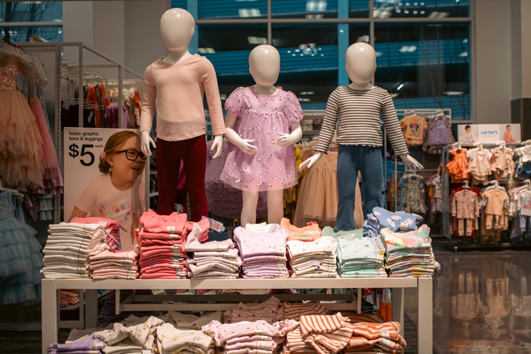 Mastering the First Impression: Your intriguing post title goes here Three child-sized mannequins are prominently displayed, showcasing various outfits at Target Downtown Seattle.